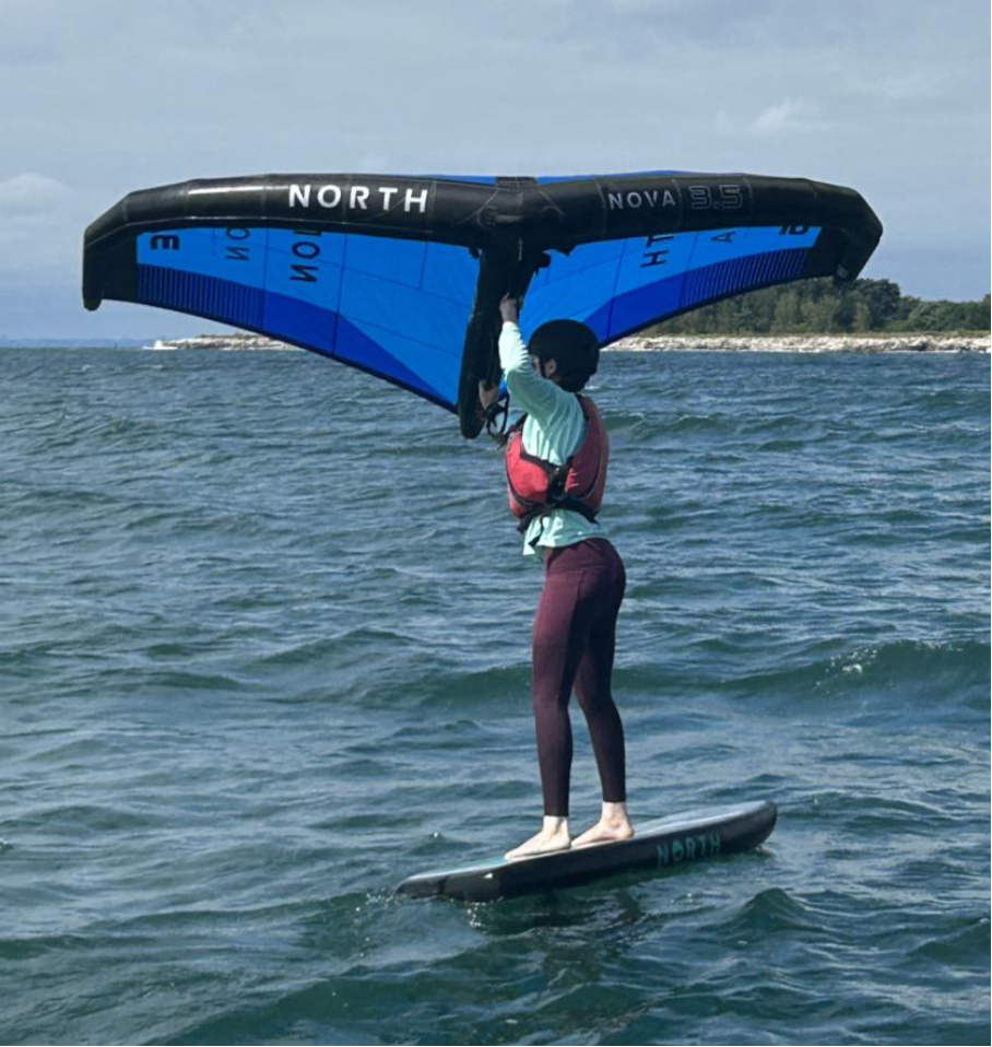 person foiling with kite